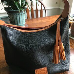 Classic Dooney & Bourke pebbled leather tassel black and tan bag